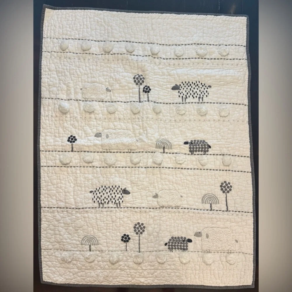 Pottery Barn Kids Shelby Sheep Baby Quilt features textured Sherpa sheep